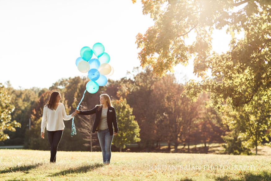 Becca and Kat walking through Fairmount Park during their engagement session