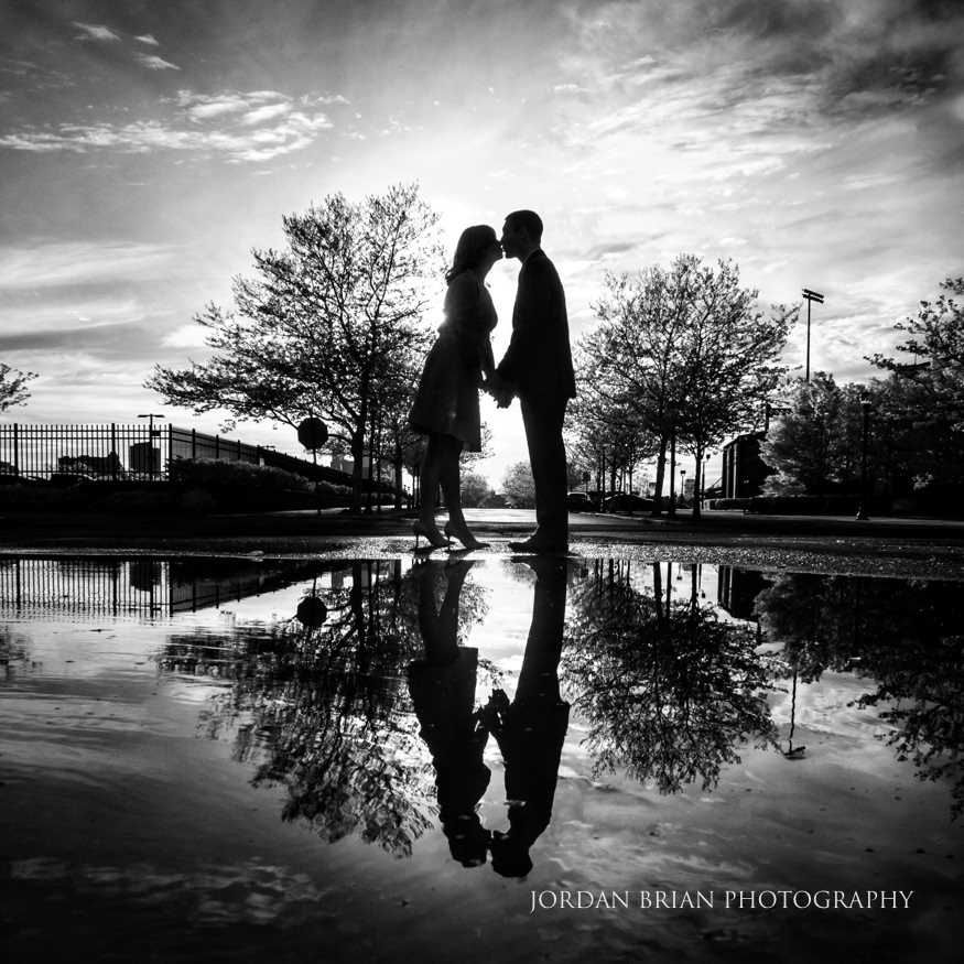 Jennifer and Michael laughing together during their Rutgers engagement session