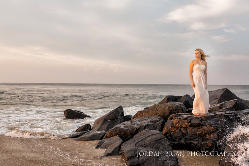 Lauren and Ryan walking the shoreline at Long Branch beach engagement session