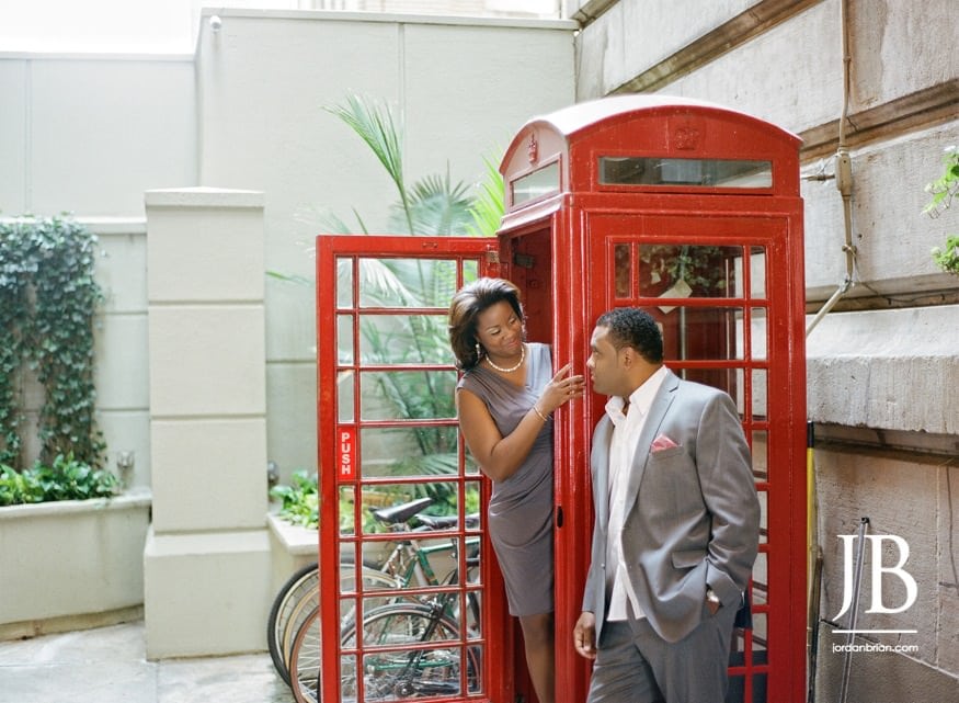 Adrienne and Joel engagement photographs near the phone booth outside Hyatt at Bellevue Philly