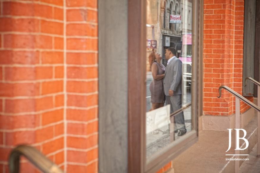 Adrienne and Joel engagement session on Broad Street Philadelphia with drum line in background