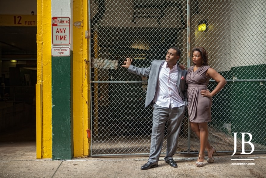 Philadelphia engagement couple Adrienne and Joel smiling Broad Street drum line