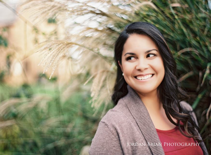 Alicia and Marc laughing during fall engagement session at Historic Smithville