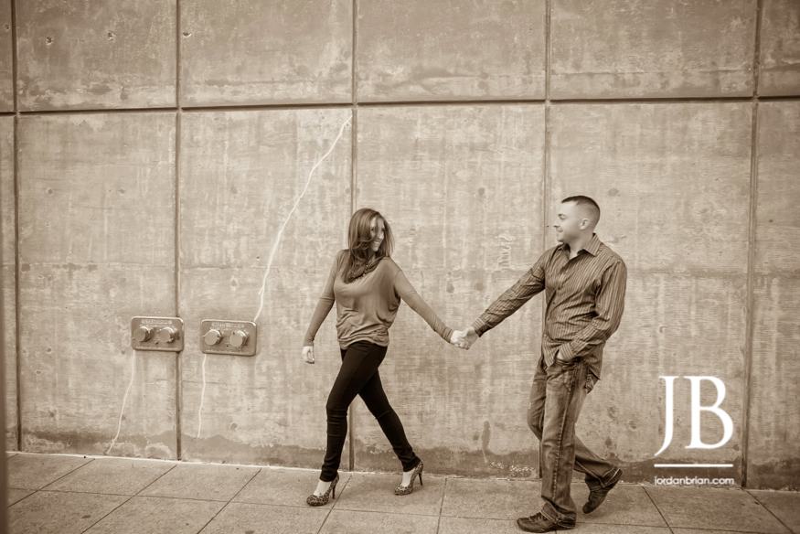 Ally and Jeff Dallas engagement session downtown city backdrop