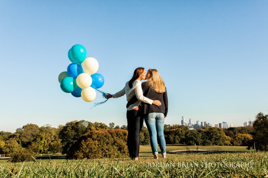 same-sex couple balloon release at Fairmount Park engagement session