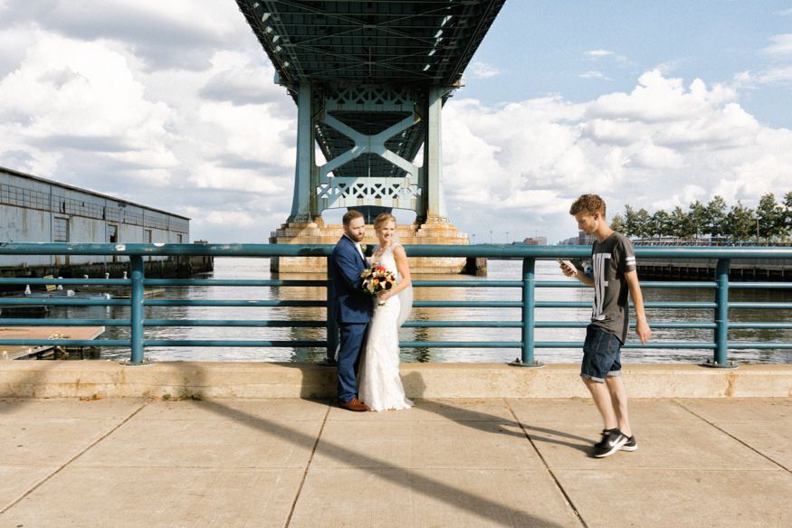 Cassandra and Ray flower girl photobomb in Philadelphia wedding portrait