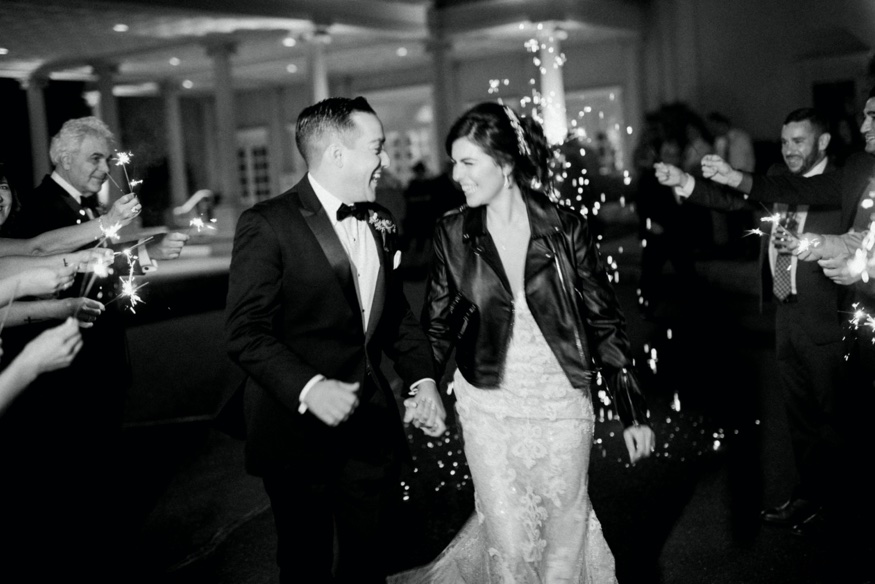 Bride and groom leaving Palace at Somerset wedding.