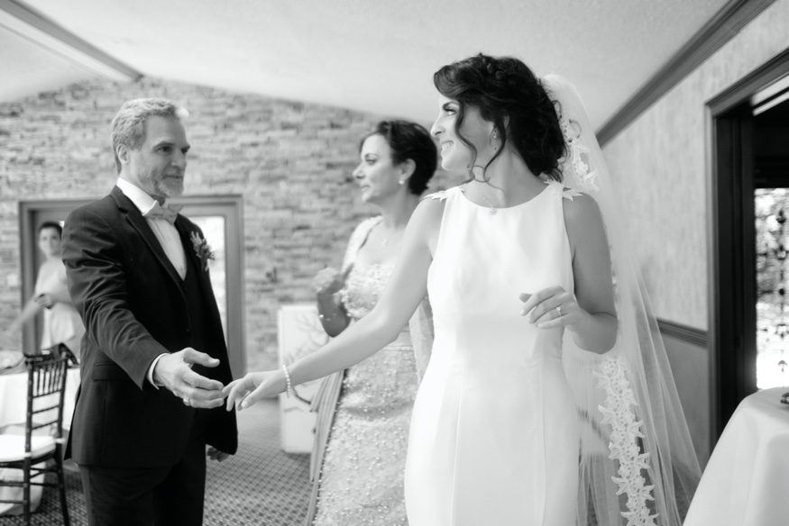 Father and daughter first look at Windows on the Water frogbridge wedding.