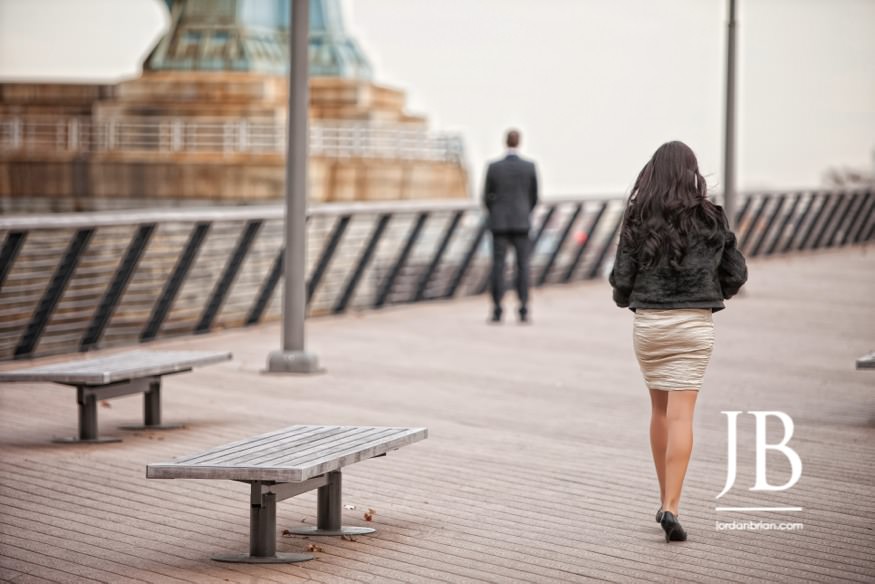 Beth walking toward Nic on Race Street Pier Philadelphia elopement