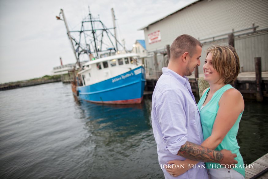 couple on fishing docks at long beach island engagement