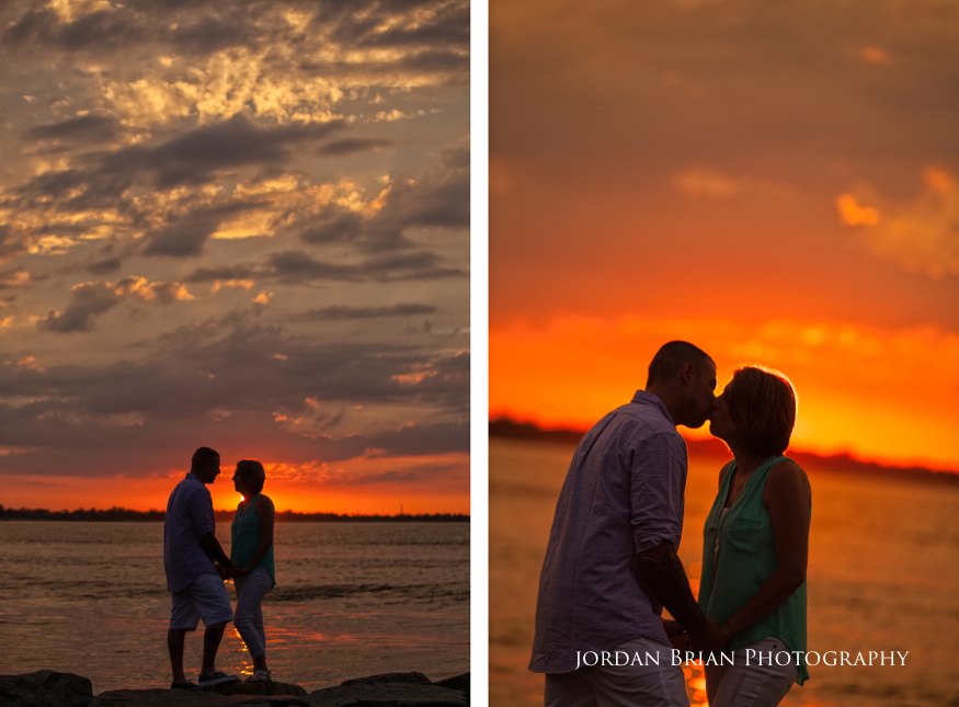 couple kiss infront of long beach island sunset