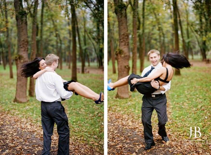 Brandi and Matt holding hands by the river at Rutgers engagement session
