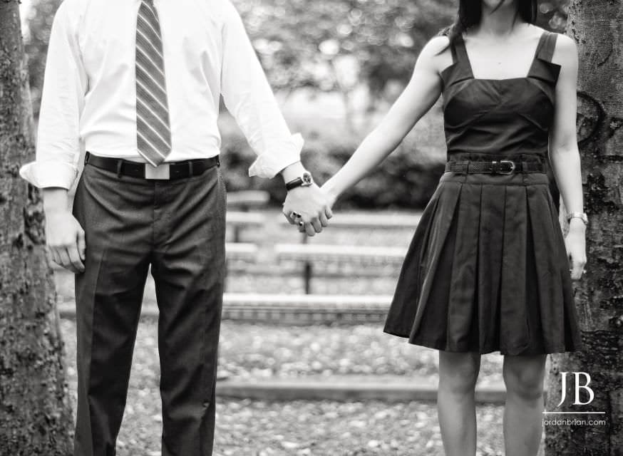Brandi and Matt by the river at Rutgers New Brunswick engagement session