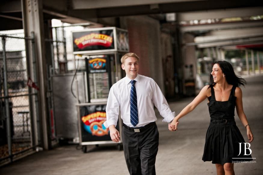 Brandi and Matt engagement portrait near Rutgers stadium New Brunswick