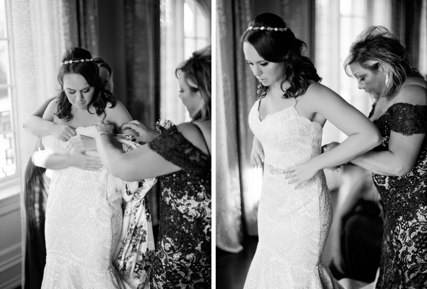 Bride getting dress in Anne Barge wedding dress at the Park Chateau.