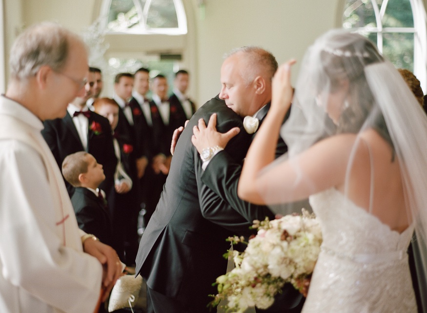 Bride and father walk down the aisle at the Park Chateau wedding ceremony.