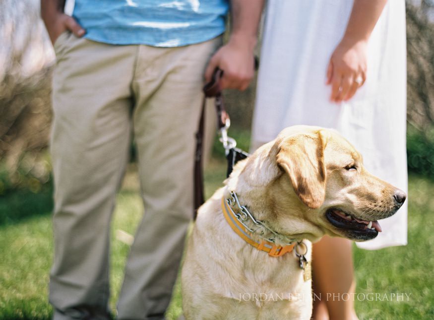 couple include their dog for their long branch beach engagement session