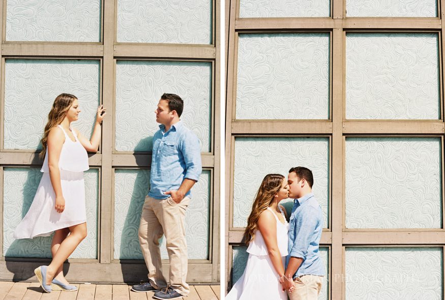 couple on boardwalk at long branch beach engagement