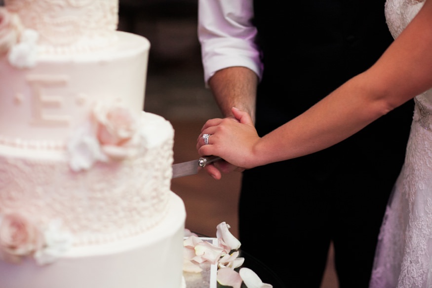 Bride and groom cut the cake at Park Savoy summer wedding.