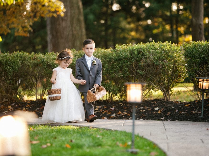 Bride walking down aisle Knowlton Mansion outdoor ceremony