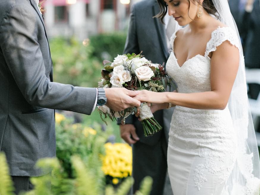 Bride and Groom at outdoor wedding ceremony at Knowlton Mansion.