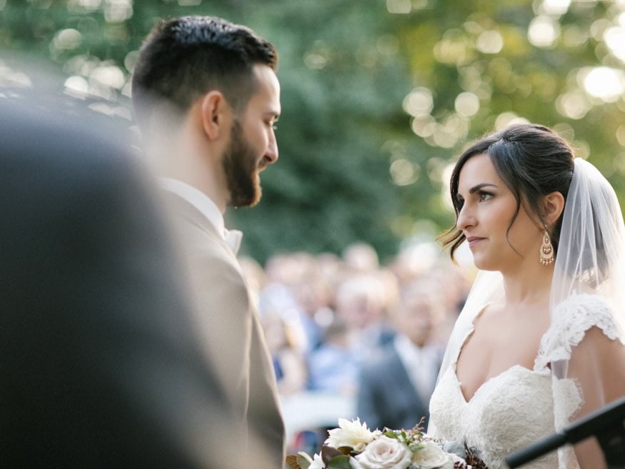 Bride and Groom at outdoor wedding ceremony at Knowlton Mansion.