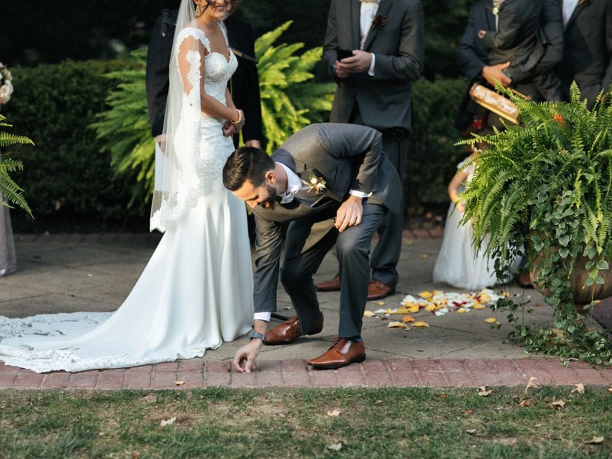 Bride and Groom at outdoor wedding ceremony at Knowlton Mansion.