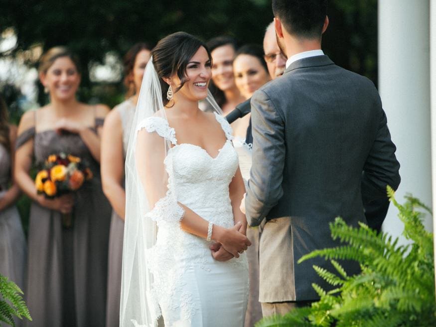 Bride and Groom at outdoor wedding ceremony at Knowlton Mansion.