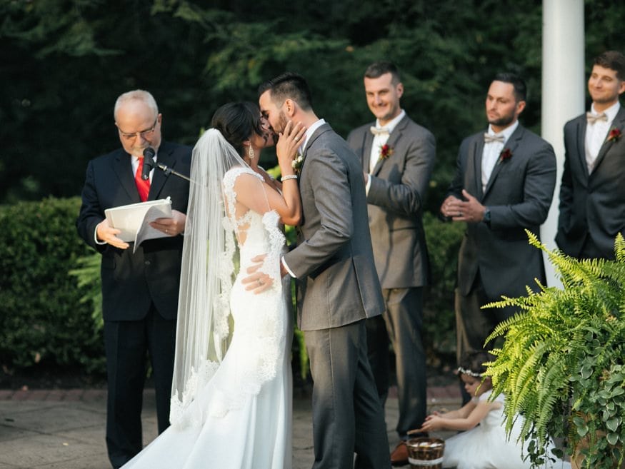 Bride and Groom at outdoor wedding ceremony at Knowlton Mansion.