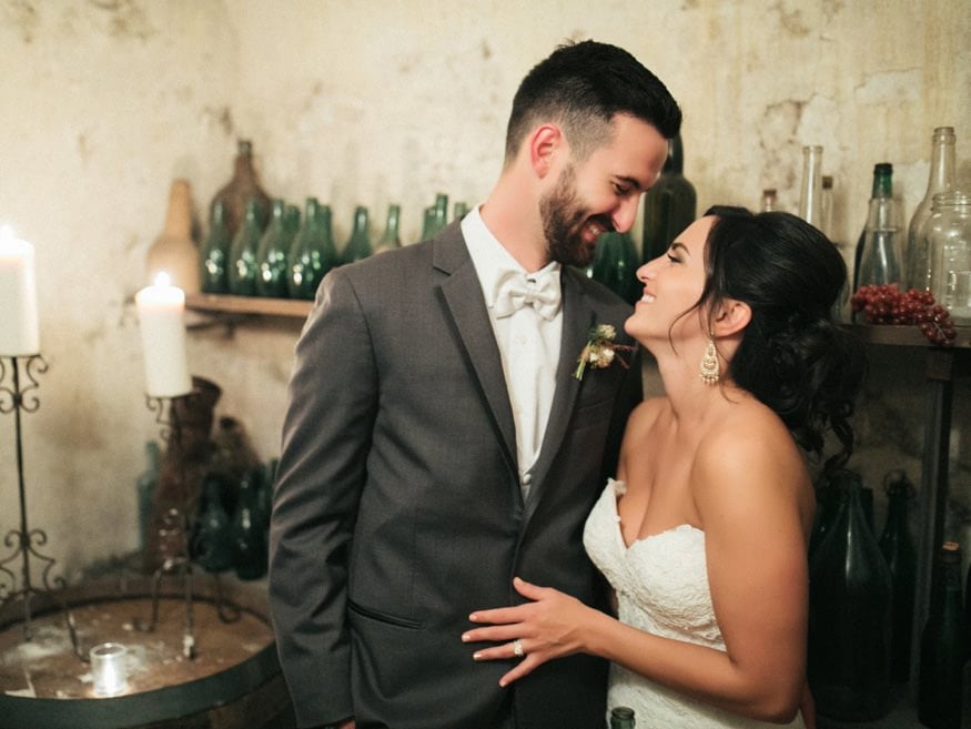 Bride and Groom night portraits in Knowlton Mansion wine cellar.