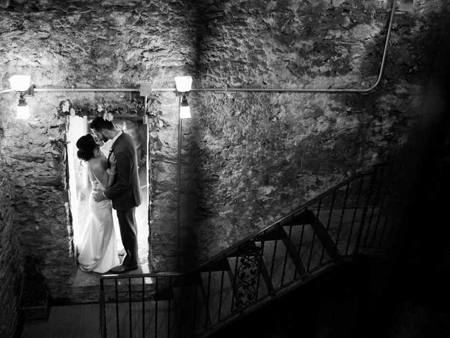 Bride and Groom night portraits in Knowlton Mansion wine cellar.