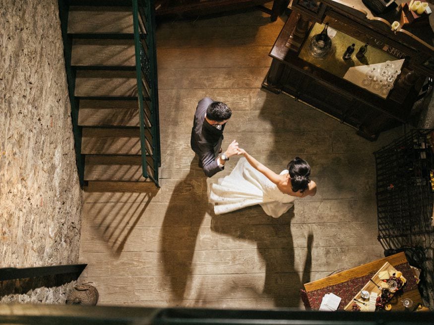 Bride and Groom night portraits in Knowlton Mansion wine cellar.