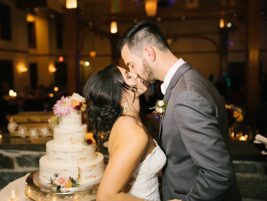 Bride and Groom cutting the cake at Knowlton Mansion wedding.