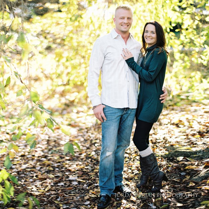 Christina and Brandon square portrait surrounded by fall foliage at Longwood Gardens engagement