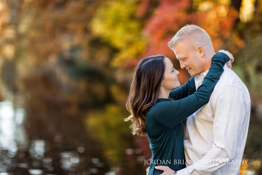 Christina and Brandon with brilliant fall color reflections at the Longwood Gardens lake