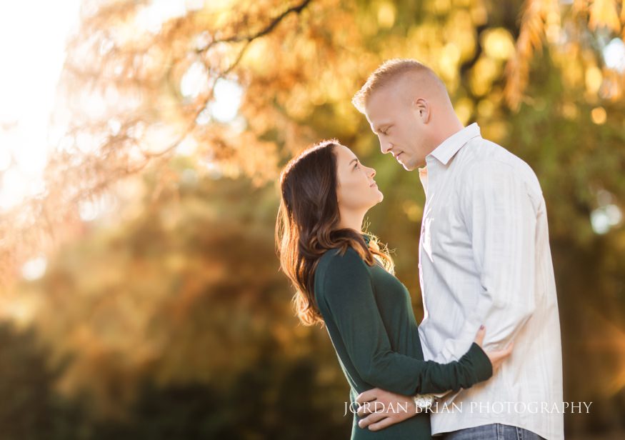 Christina and Brandon portrait with fall reflection pond at Longwood Gardens engagement