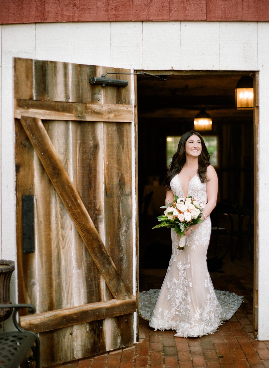 Bride's portraits in the rain at Brandywine Manor House wedding.