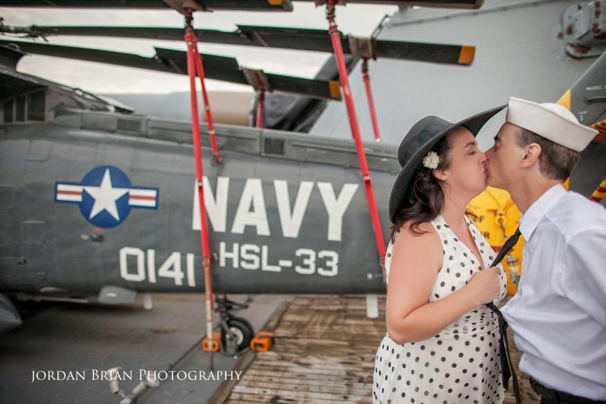 Denise and Tom holding hands on the Battleship New Jersey at their Camden engagement session