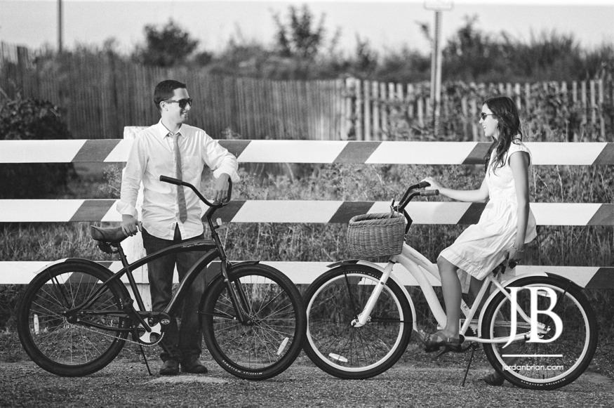 Couple on beach cruiser bikes at Ocean City New Jersey engagement portraits
