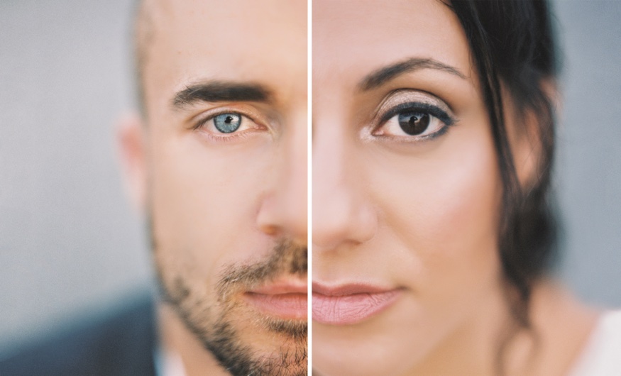 Close-up portrait of Elina and Thomas, golden hour light from sunrise over the NYC skyline.