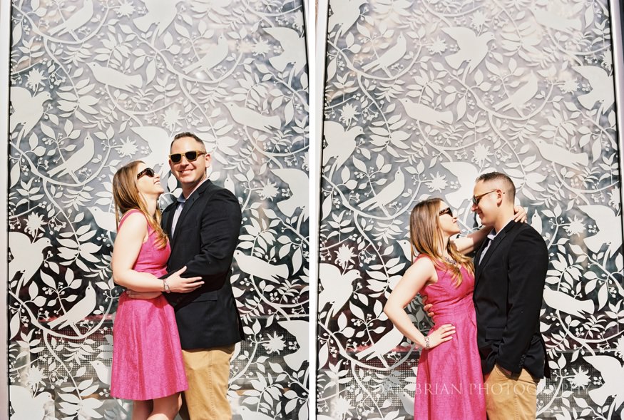 couple by glass mural at philadelphia zoo engagement session