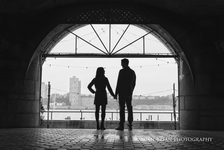 couple by hudson river for new york city engagement