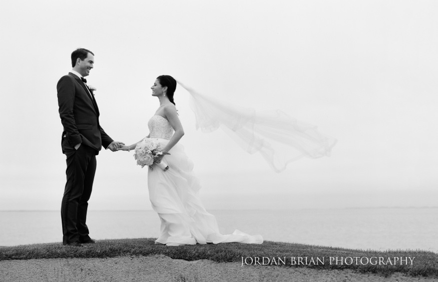 couple on golf course at rehoboth beach country club wedding