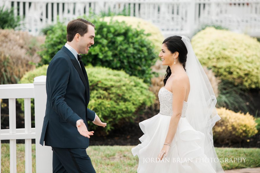 groom seeing bride for first time at rehoboth beach country club wedding