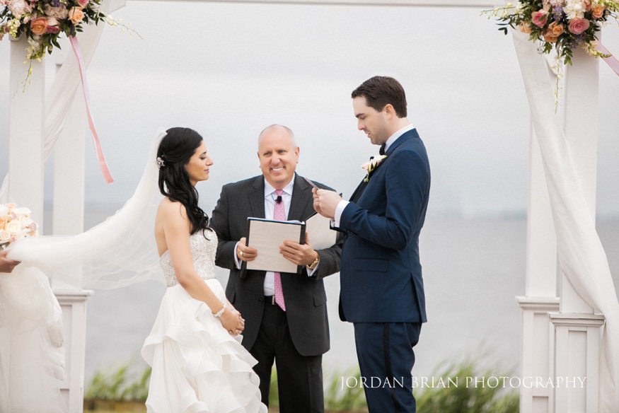 groom reading vows at rehoboth beach country club wedding ceremony