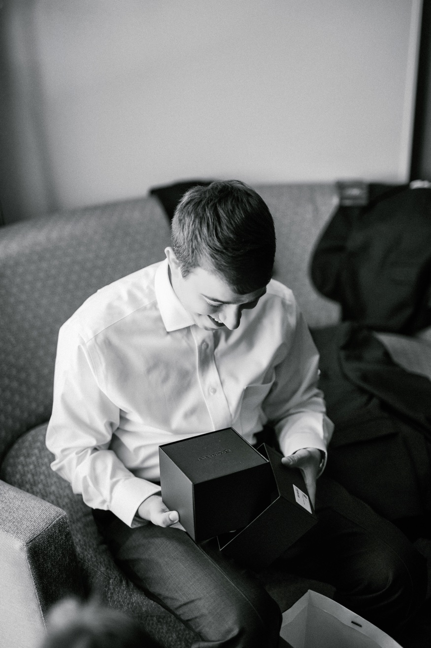 Groom's portraits at Courtyard Marriott before Pen Ryn wedding.