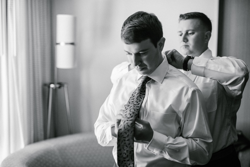 Groom's portraits at Courtyard Marriott before Pen Ryn wedding.