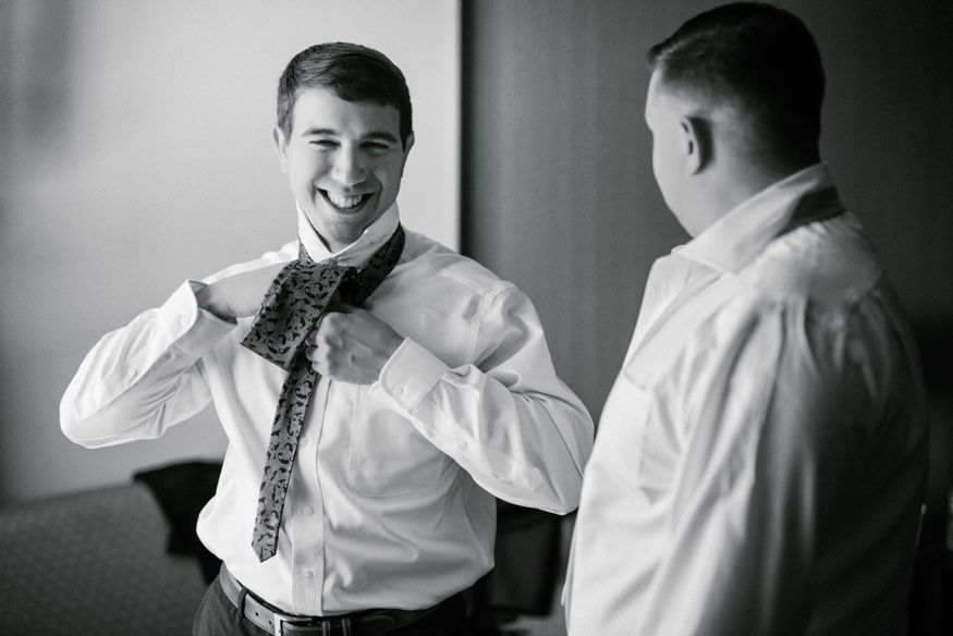 Groom's portraits at Courtyard Marriott before Pen Ryn wedding.