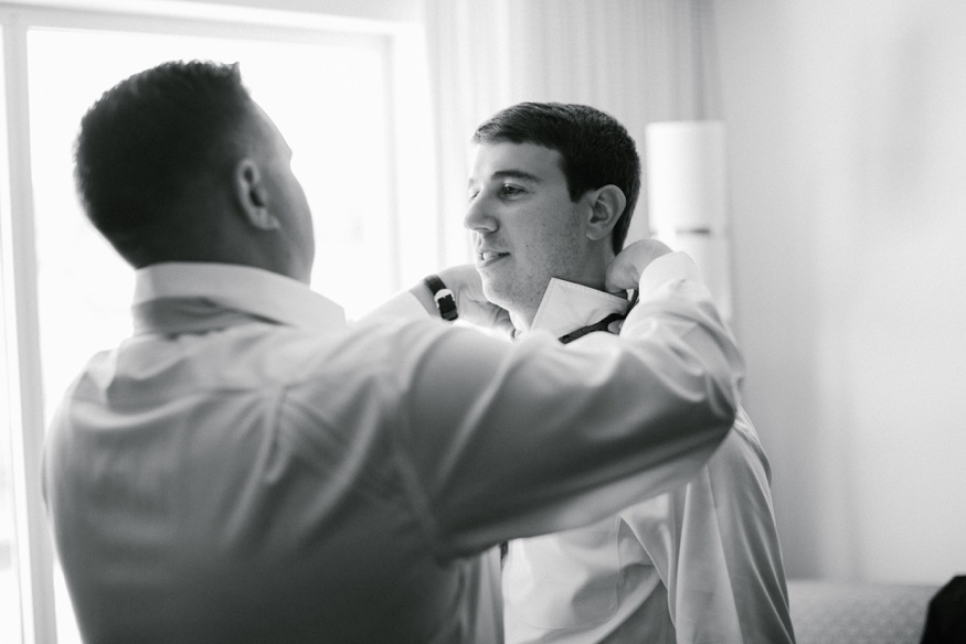 Groom's portraits at Courtyard Marriott before Pen Ryn wedding.