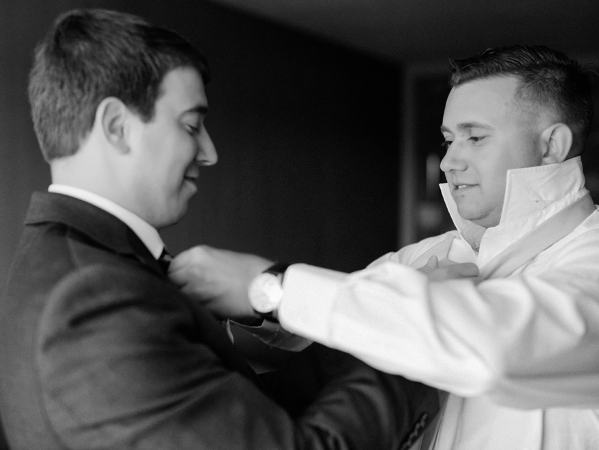 Groom's portraits at Courtyard Marriott before Pen Ryn wedding.